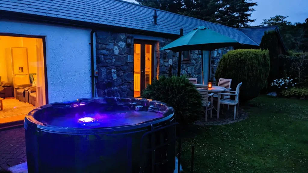 Conwy Valley Getaway | hot tub at night Steaming hot tub at night