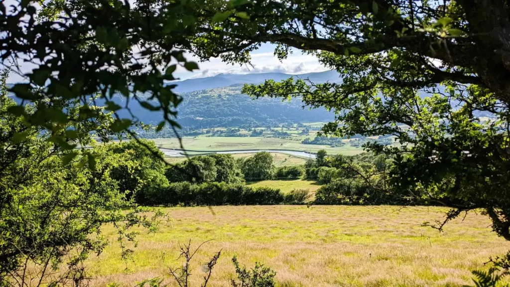 Views across the Conwy Valley with a river and mountains in the distance