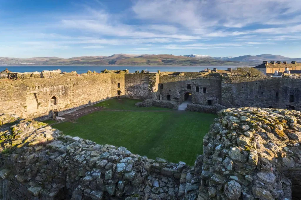 Conwy Valley Getaway | 40694 ncx kc04 1617 1394 web optimised 1920px The vast, grassy inner courtyard of Beaumaris Castle, surrounded by the high, symmetrical stone walls and towers of the unfinished inner ward