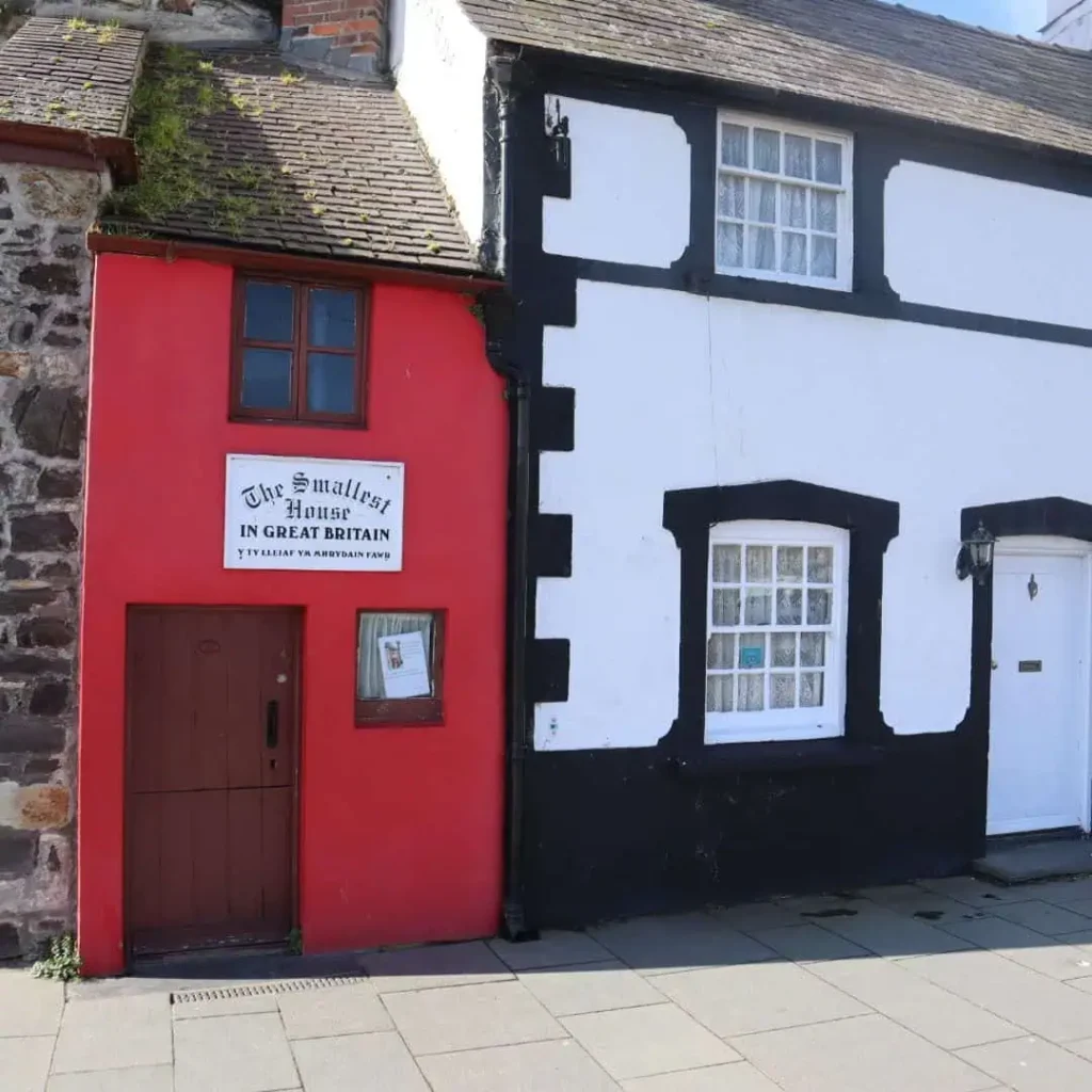 Conwy Valley Getaway | 681523 nvw f68 2324 0010 instagram square 1080px The Smallest House in Great Britain, a tiny, bright red house, nestled between other buildings on the quay in Conwy, Wales