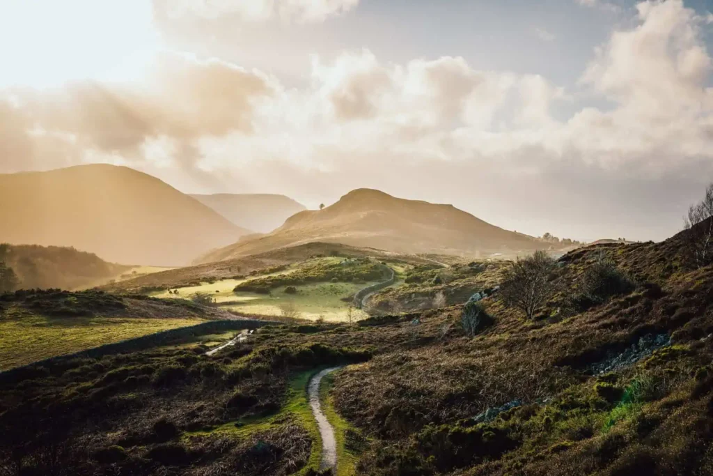 Conwy Valley Getaway | 720615 nvw g112 2425 0021 web optimised 1920px Scenic view showing a winding road running through the panoramic Eryri landscape with Conwy Mountain in the distance