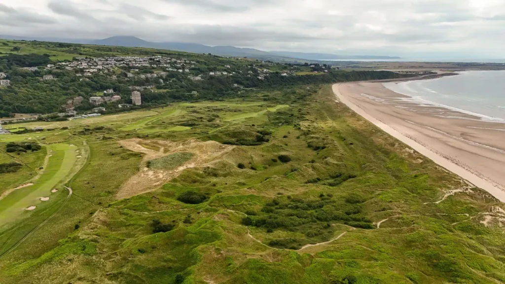 Conwy Valley Getaway | 753258 nvw h48 2526 harlech royal st davids golf course 0002 web optimised 1920px Aerial view of the green fairways and bunkers of Royal St David's links golf course, situated directly beside the sandy dunes and the blue sea of Tremadog Bay