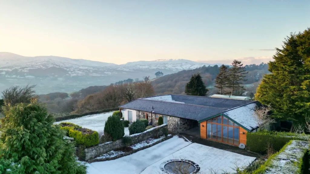 Conwy Valley Getaway | fig laurel cottages winter Aerial view of Fig Tree and Laurel holiday cottages on a winter's day with snow on the ground