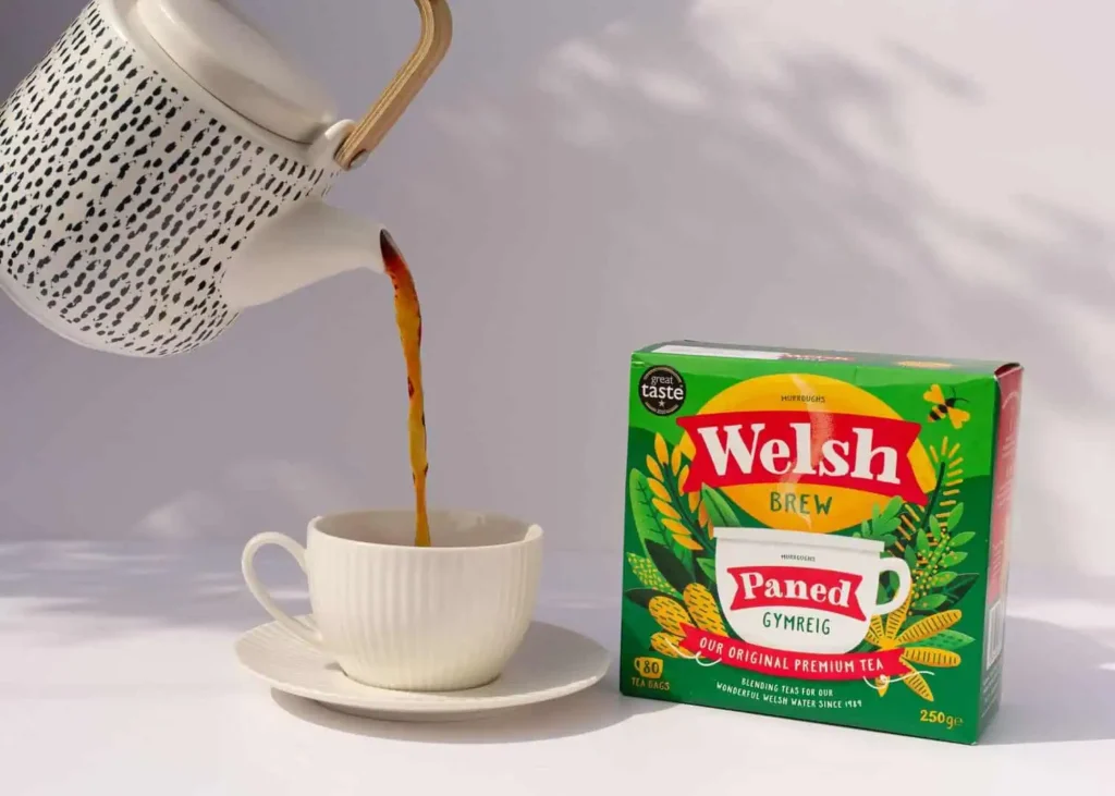 Close-up of hot Welsh tea being poured into a white cup