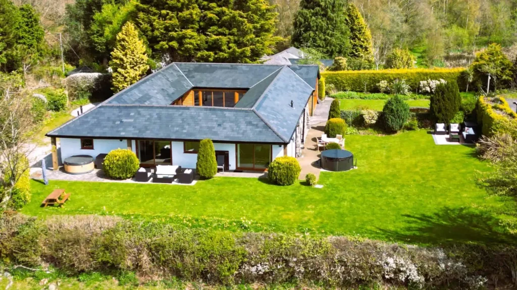 Aerial view showing the quadrangle building and gardens at Conwy Valley Getaway