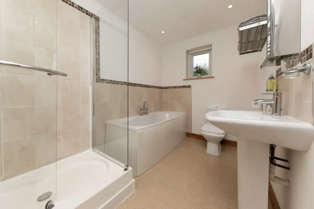 Fig Tree bathroom with freestanding bath, walk-in shower and window